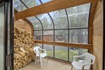 Nice sunroom and wood for the fireplace